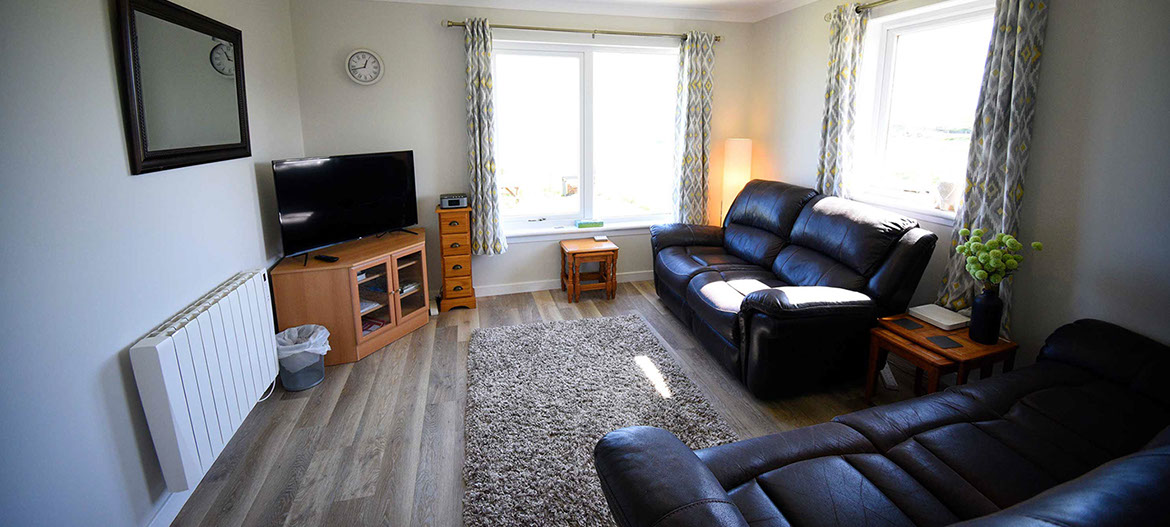 Anmara self catering accommodation contains a comfortable living room with sea views and widescreen TV